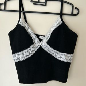 Black cropped adjustable tank top with white lace and small ribbon